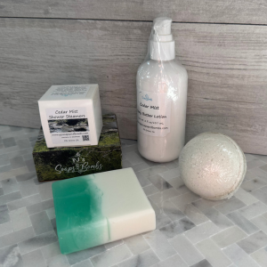Cedar Mist Scented Collection, Soap, body lotion, Bath Bomb and Box of Shower Steamers in rustic setting