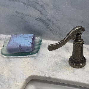 Lifestyle of Moonlit Ocean Soap resting on soap dish in bathroom