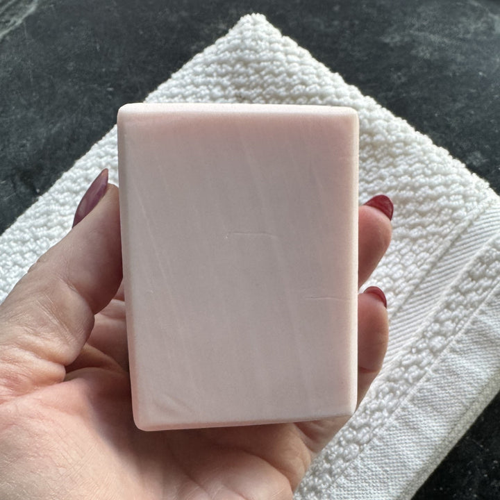 Backside of Pink Plumeria Soap being held