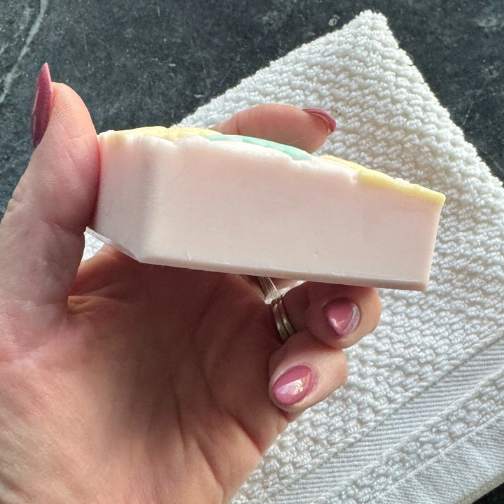 Side detail of Pink Plumeria Soap being held