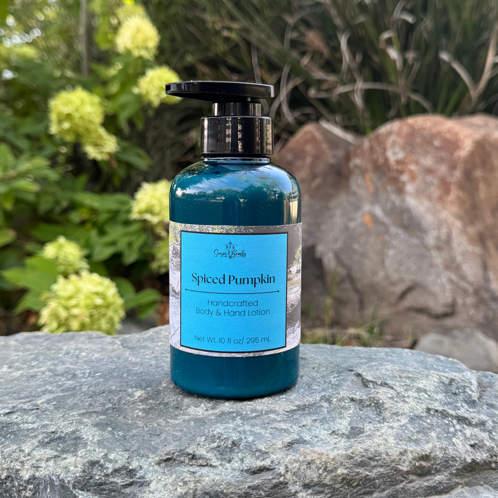 Spiced Pumpkin Handcrafted Body Lotion sitting on a rock