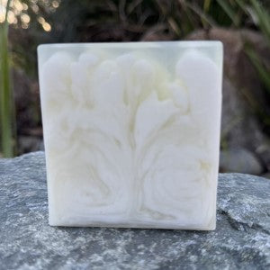 Front View Unscented Luxury in natural setting showing movement of soap