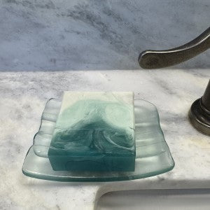 Lifestyle picture of White Birch Soap resting on countertop soap dish