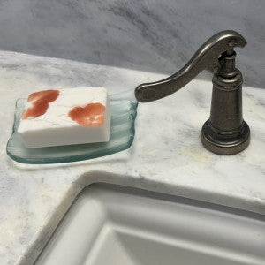 Lifestyle picture of Moonlit Jasmine Elixer Soap sitting on countertop