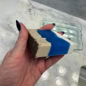 Side view of Ocean Shores Soap, showing exfoliating bottom layer of coffee grounds and side with layers