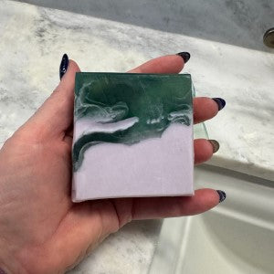 Close-up of Serene Soap's textured side in hand.
