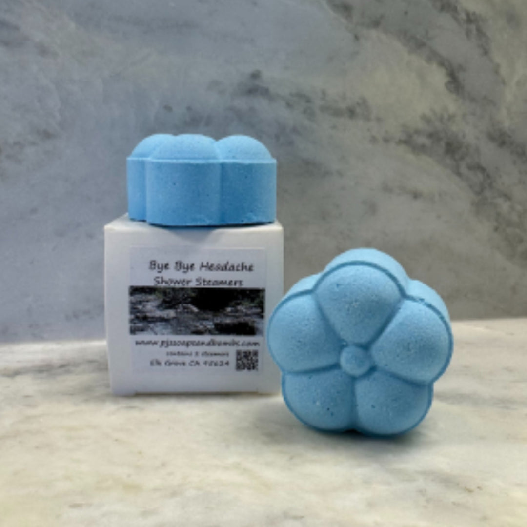 Bye Bye Headache blue shower steamers with box sitting on counter