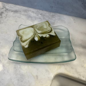 Eucalyptus Escape Soap resting on glass soap dish 
