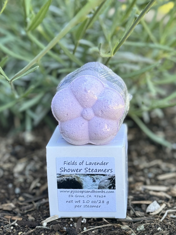 Lavender scented Shower Steamer sitting on a white box.  Fields of Lavender