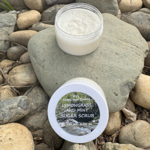 Lemongrass and Mint Sugar Scrub open in a natrual setting