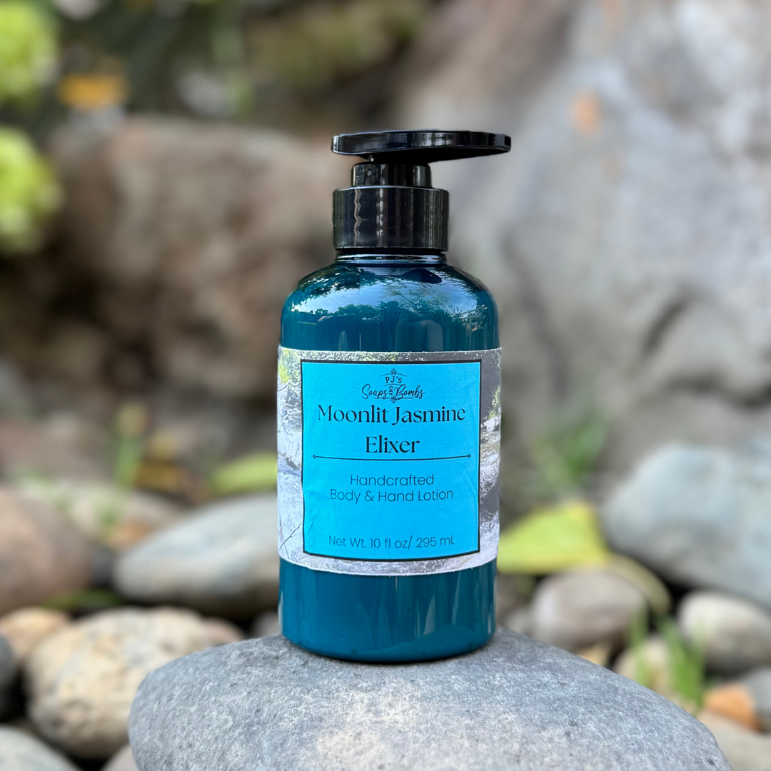 Blue bottle of 'Moonlit Jasmine Elixer' on a rock with a natural background