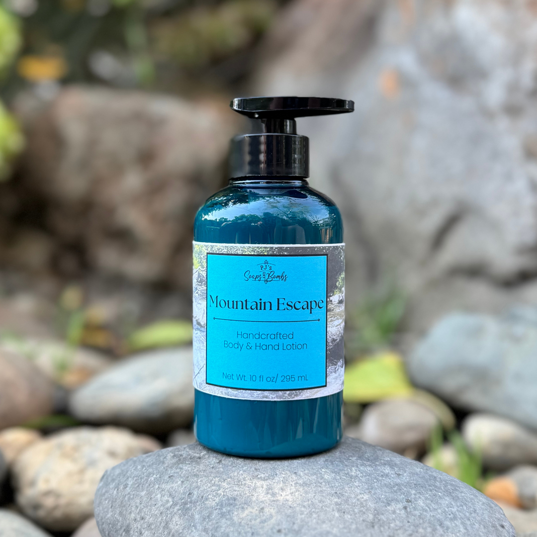 Blue bottle of 'Mountain Escape' lotion on a rock with a natural stone background