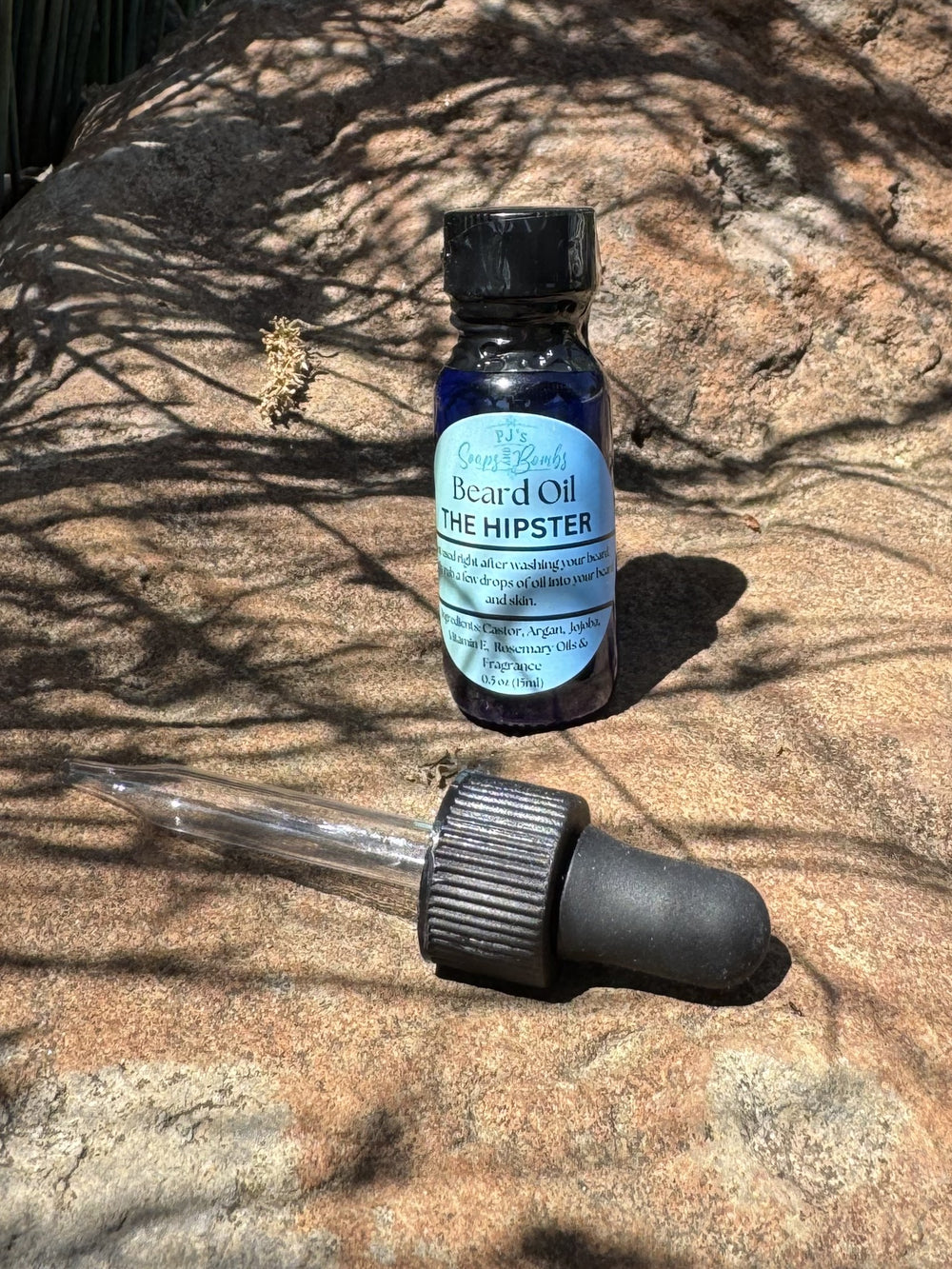 The Hipster  Beard Oil and Dropper in outdoor setting