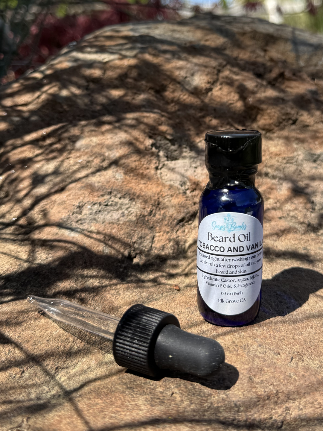 Tobacco and Vanilla  Beard Oil and Dropper in outdoor setting