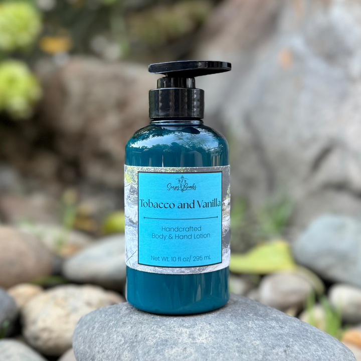 Tobacco and Vanilla Body Lotion in a blue bottle sitting on a rock