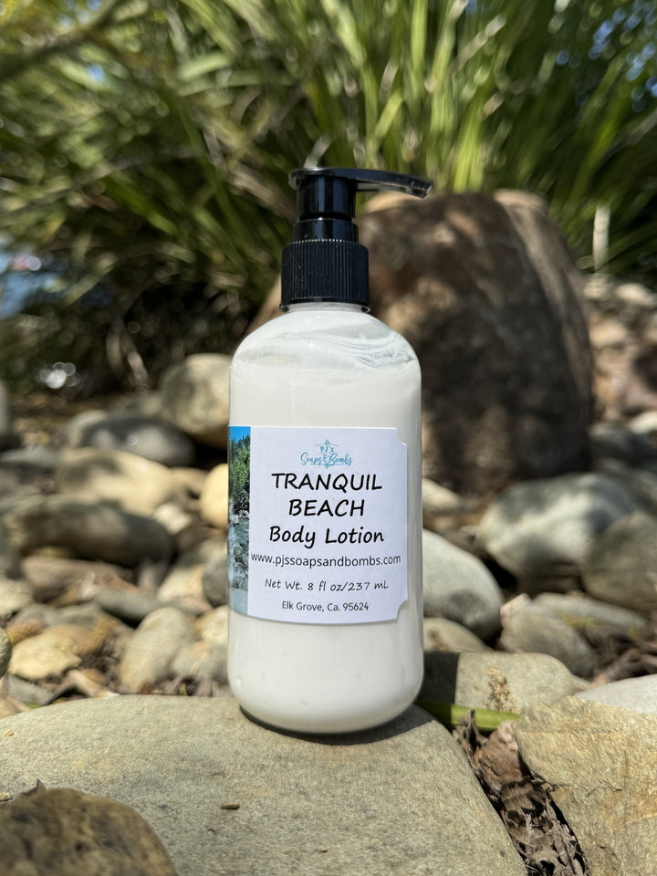 Tranquil Beach Body Lotion in natural setting sitting on a rock
