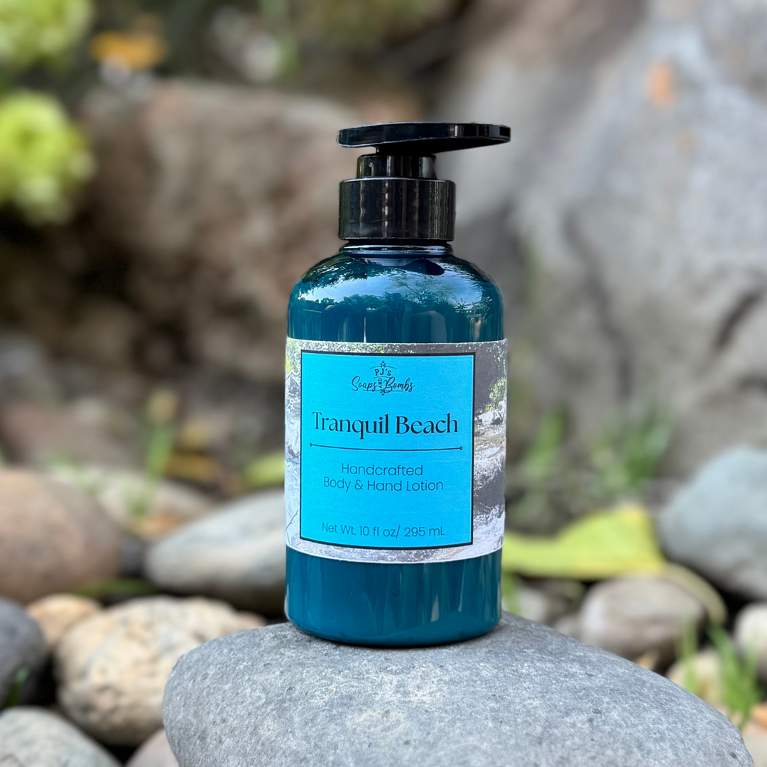 Blue bottle of 'Tranquil Beach' lotion on a rock with a natural background