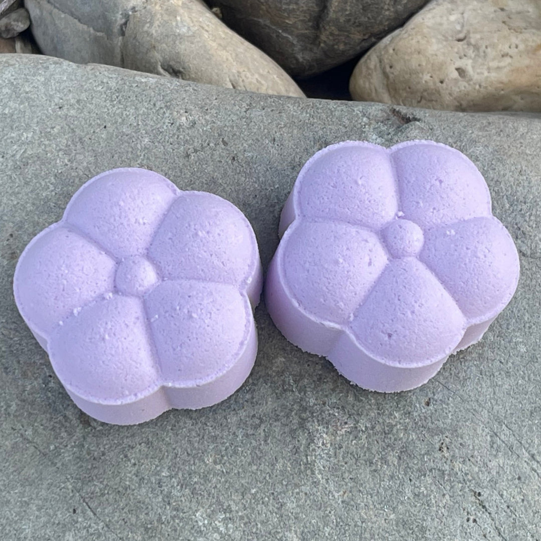 Tranquil Lavender Twilight Shower steamers lavender color sitting on a rock