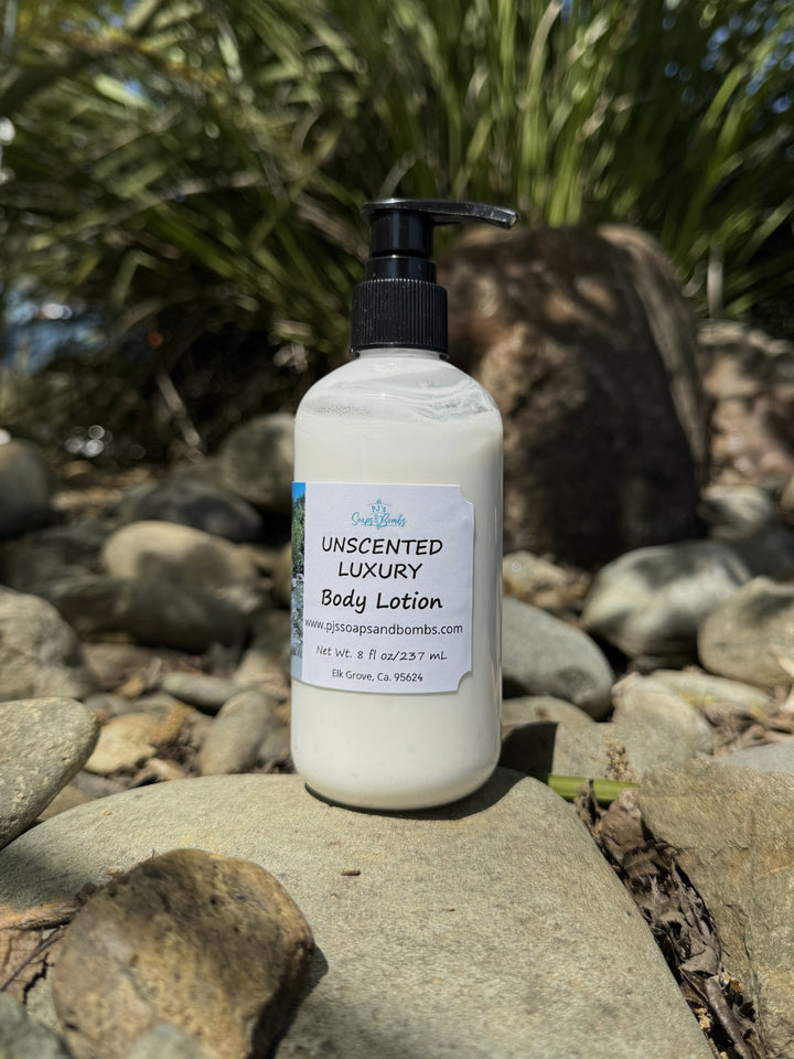 Unscented Luxury Body Lotion in natural setting sitting on a rock